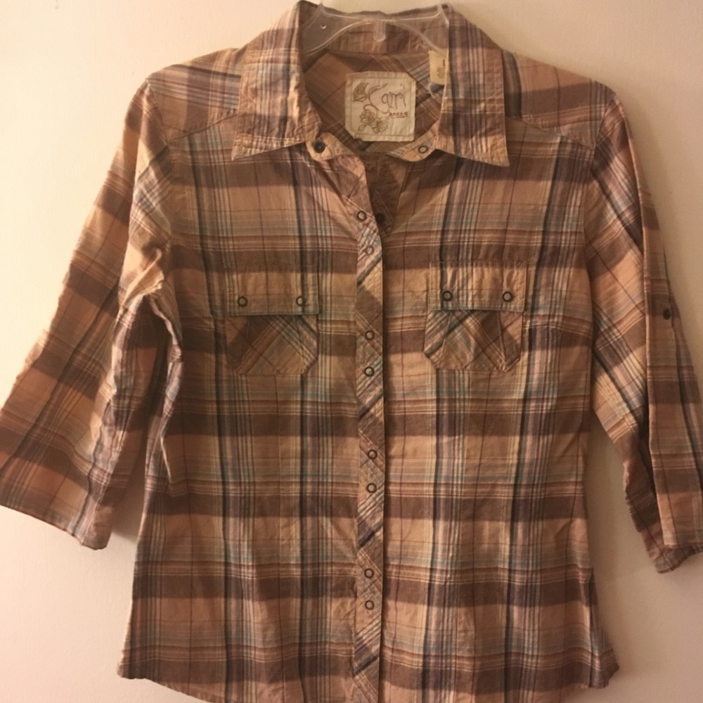 Plaid shirt with snaps instead of buttons.